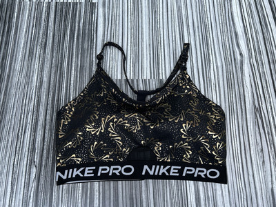 black and gold nike sports bra