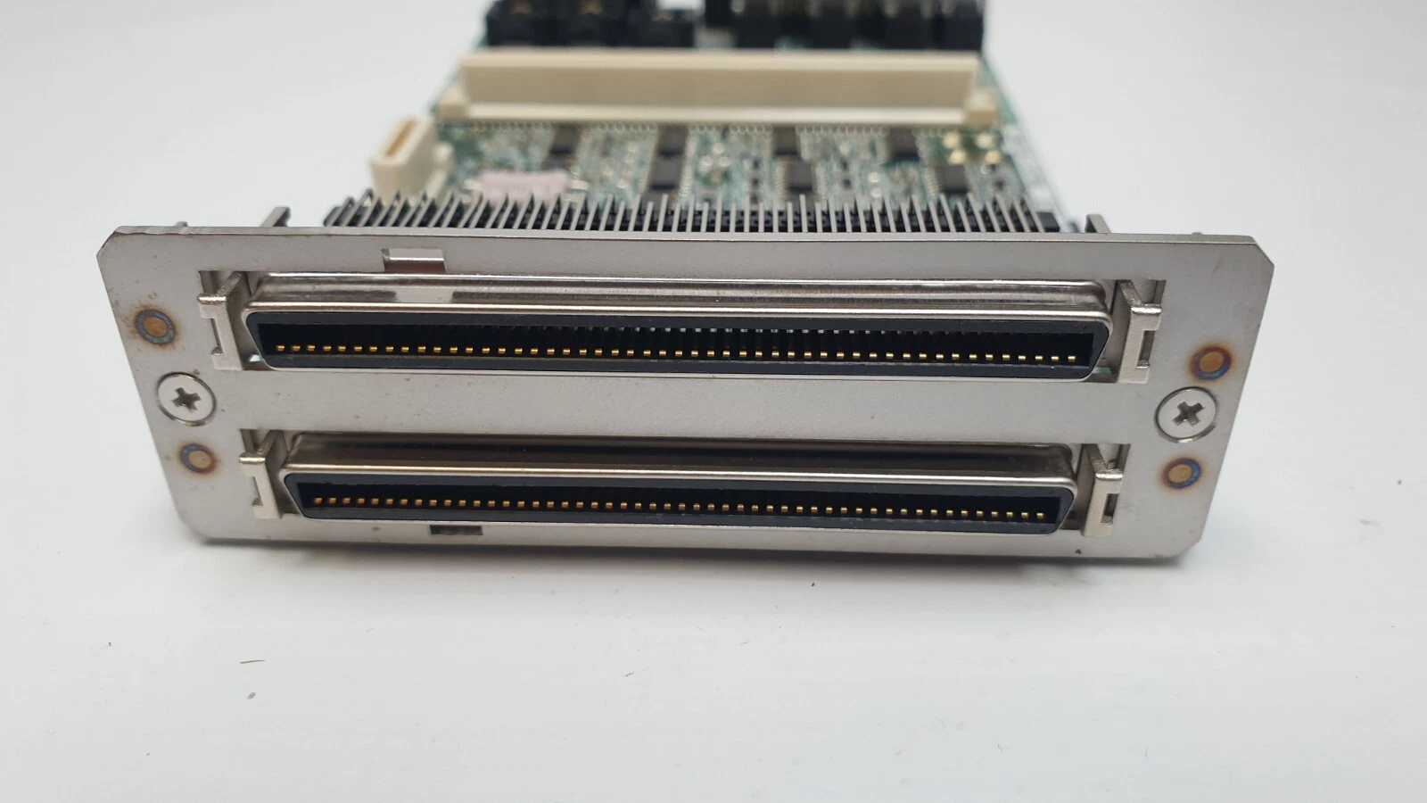 Opposite end bracket of the TDB218-1/BTM2 assembly with two wide shielded half-pitch connectors