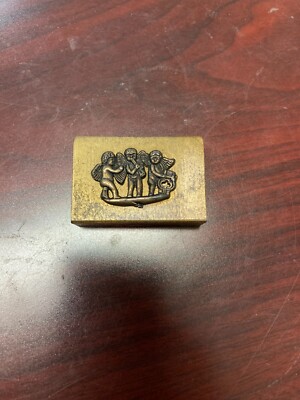 SMALL BRASS RING MATCH TICK BOX CHERUBS PLAYING MUSICAL INSTRUMENTS VINTAGE