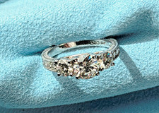 Lady's 6.5mm  two 4.5mm Rd Brilliant Cut Moissanite in Sterling Silver Ring