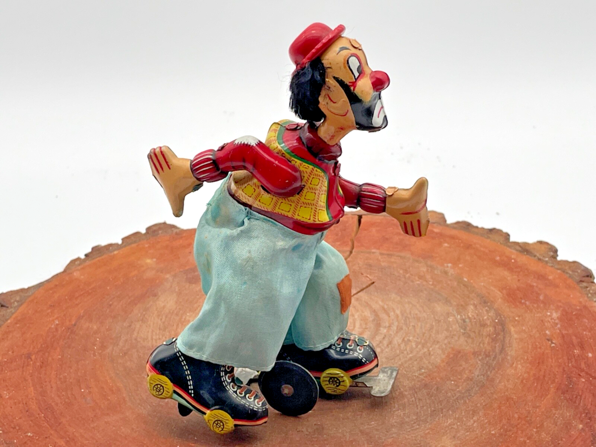 Vintage TPS Made in Japan Tin Litho wind up Clown Skater--works