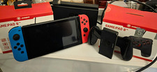 Nintendo Switch Konsole 32 GB Schwarz mit Joy-Con Rot/Blau und Dock