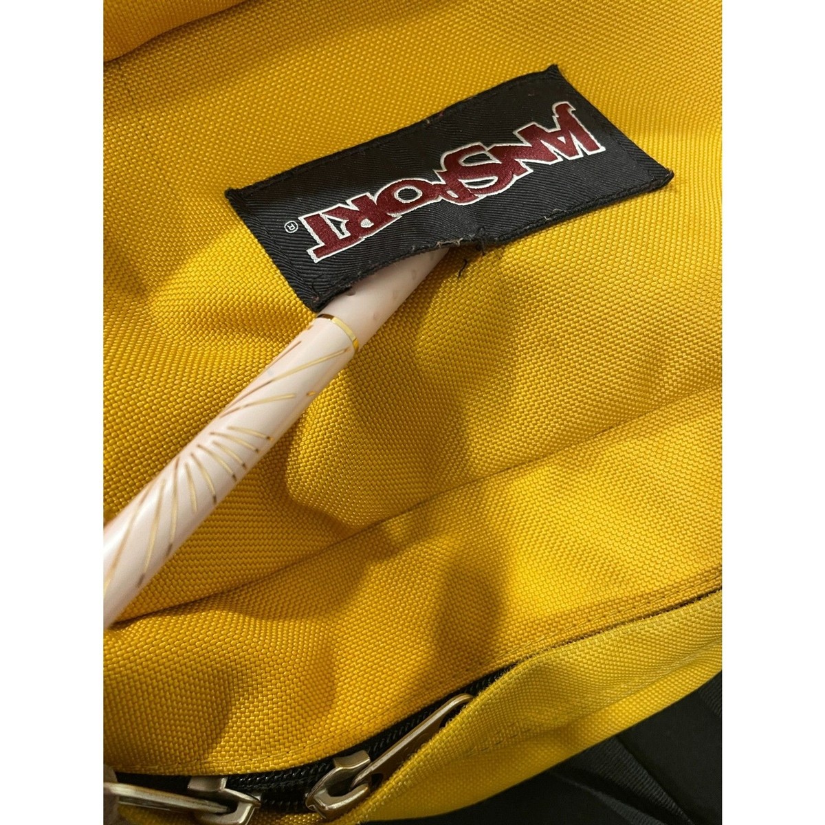 JanSport yellow gold backpack fabric leather zip pockets