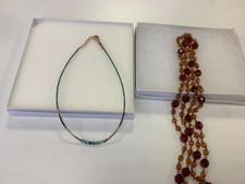2 costume necklaces with boxes (marks on boxes see photo for image)