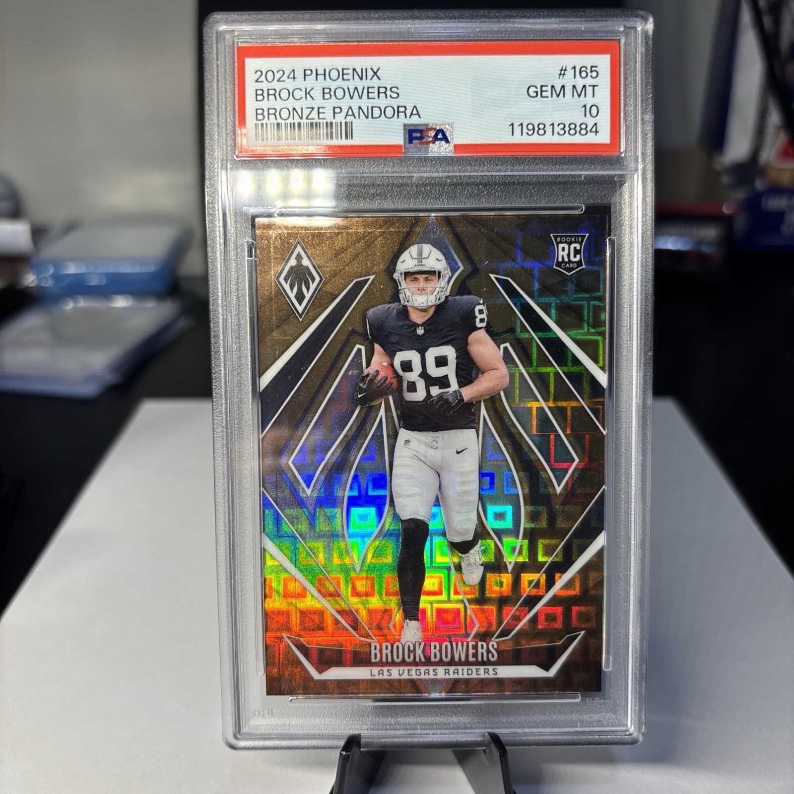 2024 Panini Phoenix - Rookies Brock Bowers #165 Bronze Pandora /33 (RC)