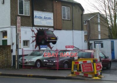 PHOTO  HELL LLP BRIDGE GARAGE SURBITON - WITH AN EYE-CATCHING TROMPE L'OEIL PAIN