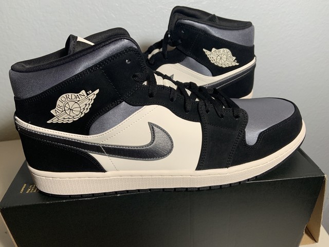 black and grey jordan 1 mid