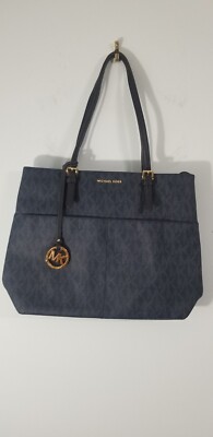 Michael Kors Leather Monogrammed Purse. 4 Exterior Slip Pockets. Clean Interior.