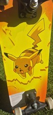 RARE Vintage 1998 Pok&eacute;mon Pikachu skateboard features a yellow  orange design.