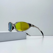 Oakley Romeo X-Metal sunglasses*, silver frame. Golden lenses
