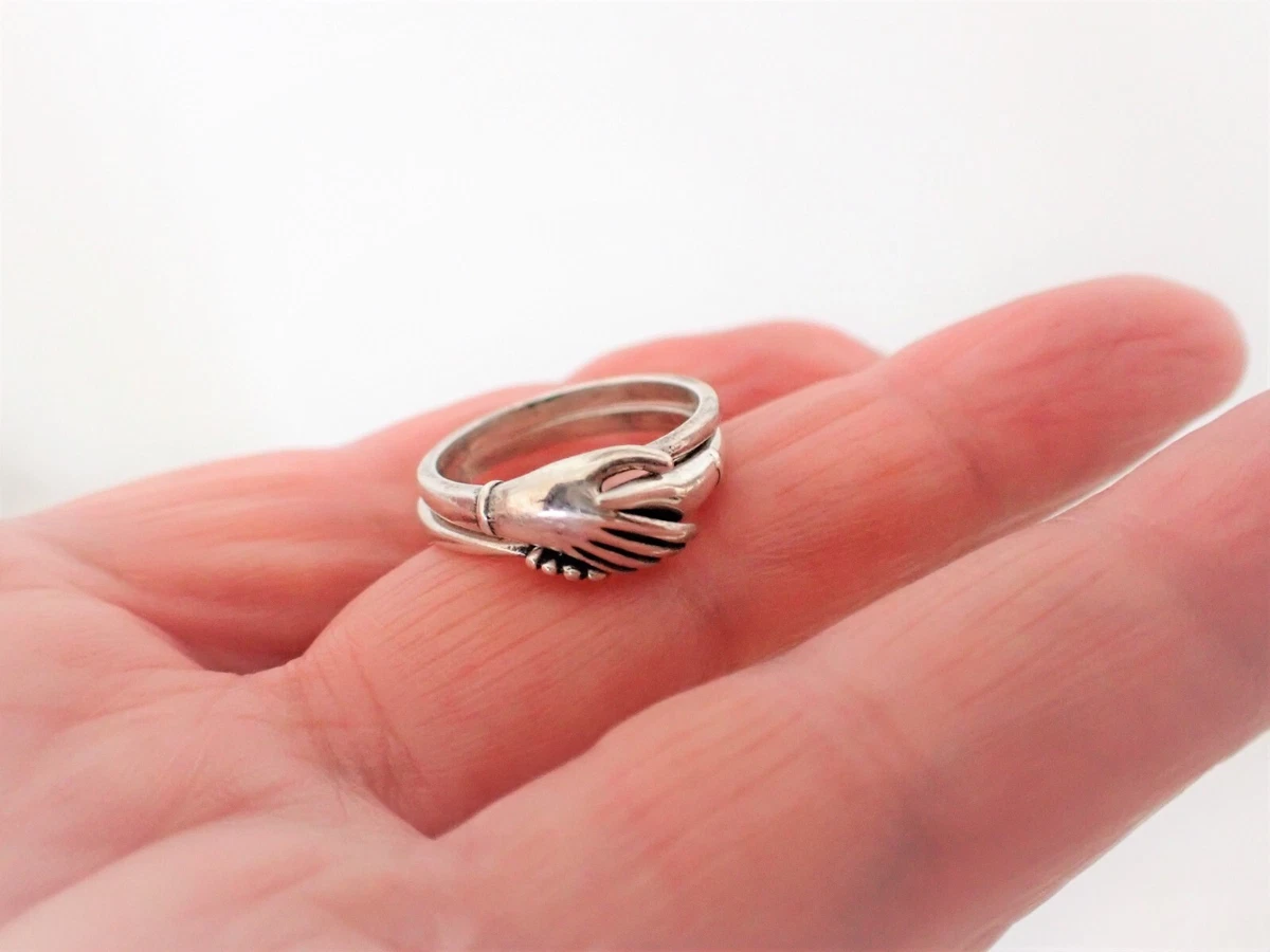 Hold Hand Ring: A Golden Embrace of Love and Elegance