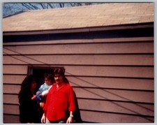 Vtg B&W Snapshot Family Man Red Shirt Woman Child Wood Siding Building 1970s
