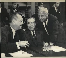 1964 Press Photo Thomas M. Goodfellow Speaks with Men at Desk - tub13596