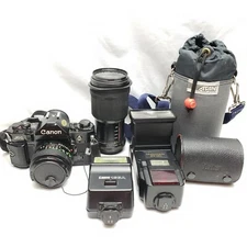 Canon A-1 Film Camera w/ 50mm & 75-200mm Lenses, Speedlite & Quantaray Flashes