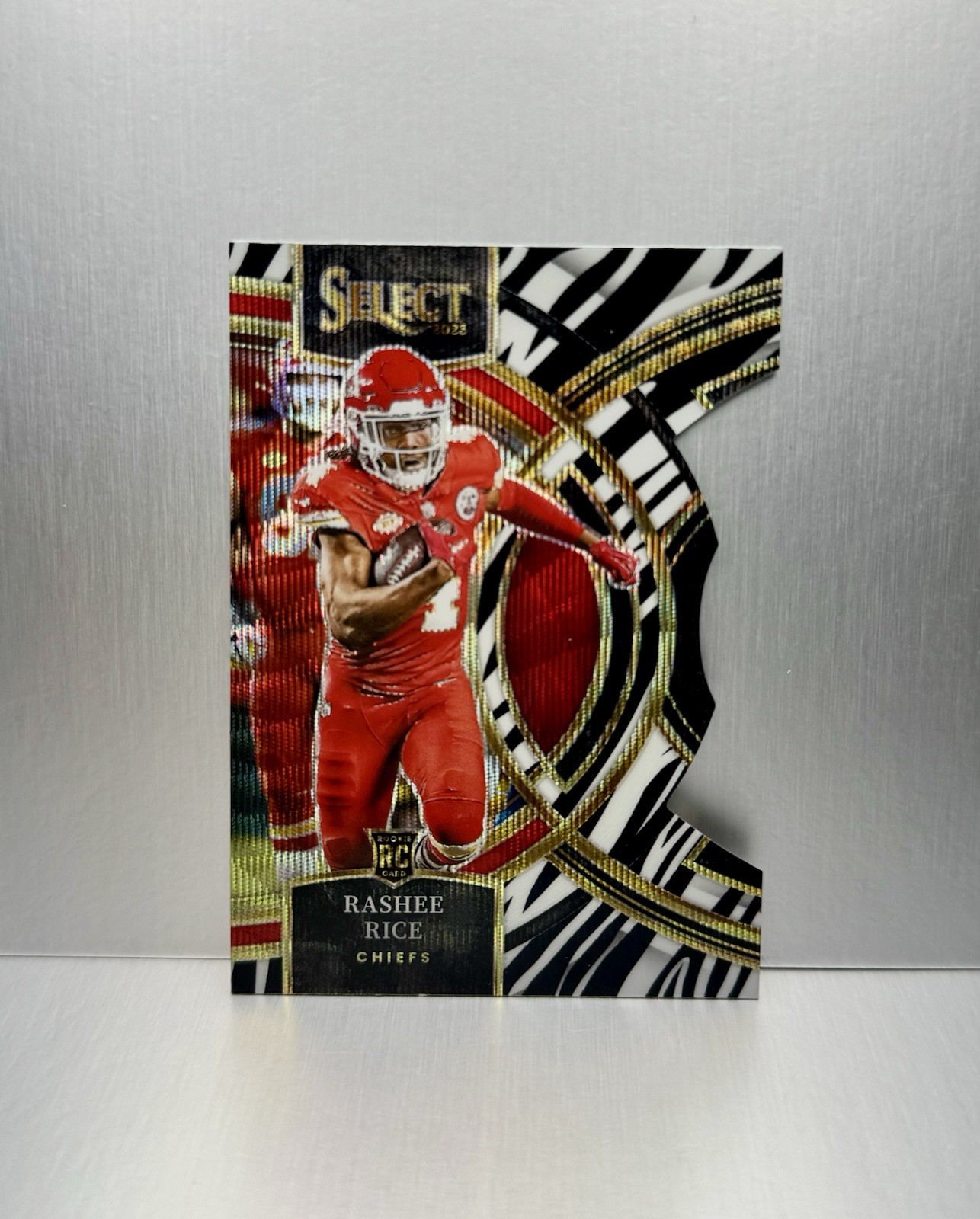 2023 Panini Select Premier Level Zebra Rashee Rice Rookie RC (#132) (Case Hit)