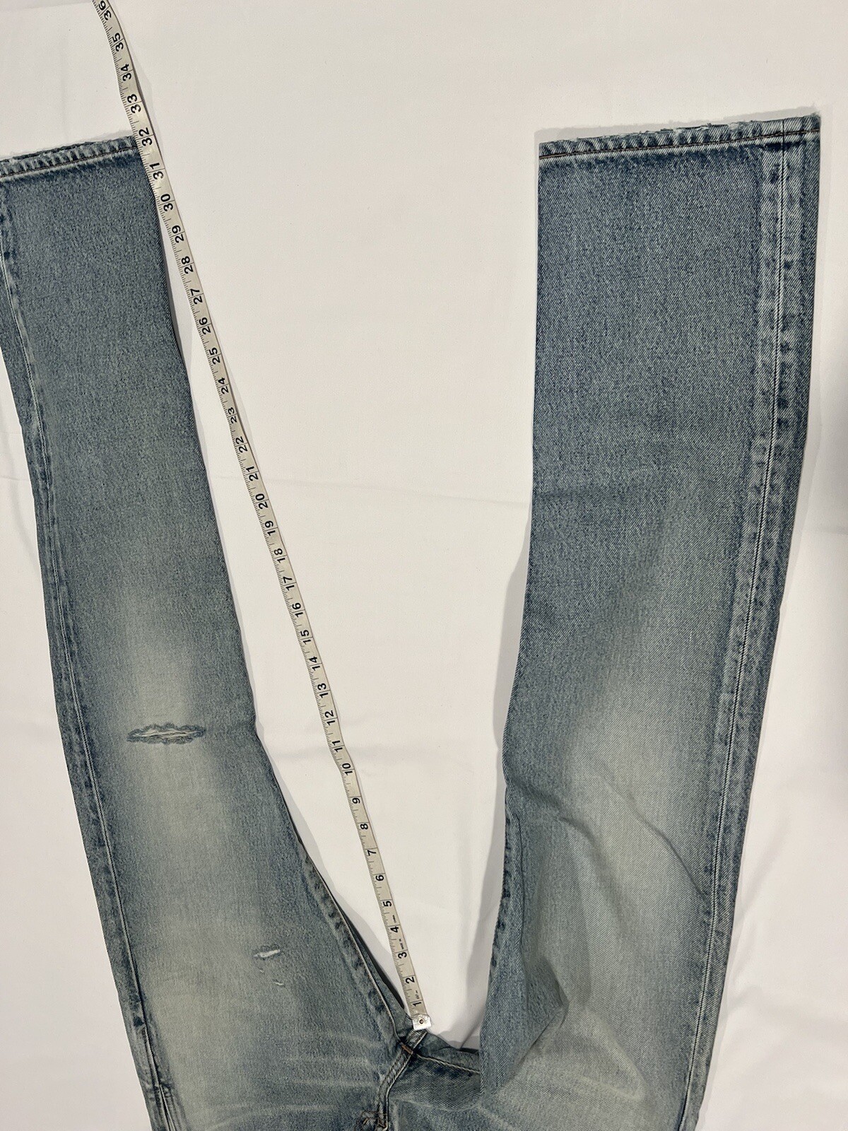 jeans uomo saint laurent ginocchio strappato blu. 33. $790