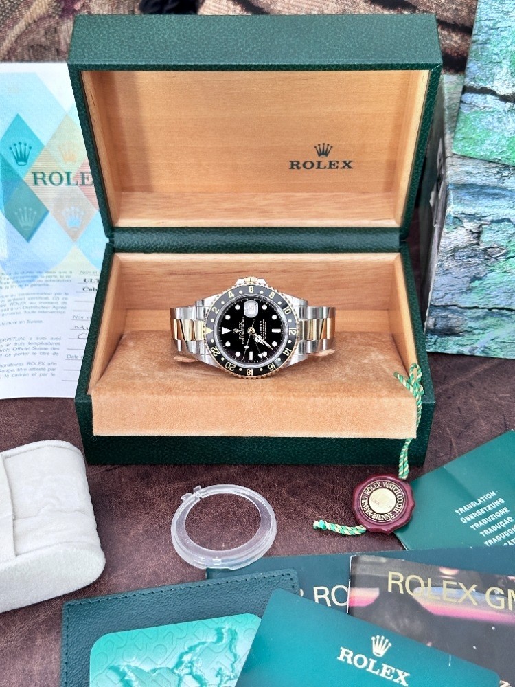 Nice Rolex GMT-Master II Men's Gold & Stainless Black Face Watch - 16713 2004