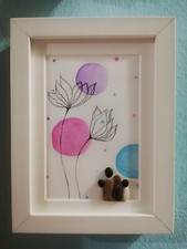 Quadri dipinti e realizzati interamente a mano con sassi e legni di mare.