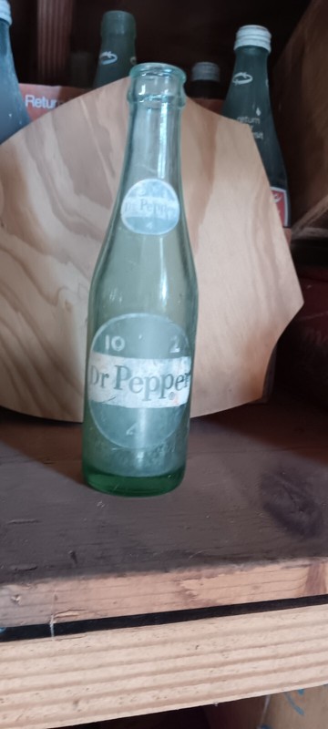 VINTAGE DR PEPPER BOTTLE. COLOR FADED SOME 10 OZ