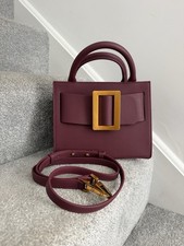BOYY Bobby 23 tote bag in burgundy leather with an oversized gold-tone buckle.