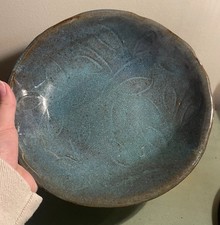 Handcrafted ceramic bowl with a celadon-style glaze