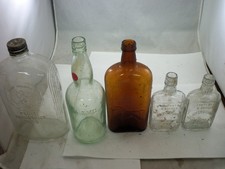 lot of 5 embossed & pictoral whiskey bottles
