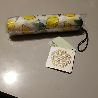 lemon print patio umbrella the LIMONE Beach 32” wide when open 23.5 tall (top to handle bottom) Bamboo and synthetic silk Handmade in China Not for use in rain Our Beach Umbrella Patio Umbrella