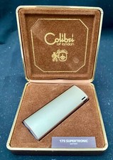 ACCENDINO A GAS VINTAGE UK COLIBRI DI LONDRA (179-SUPERTRONIC) METALLO con la SUO CUSTODIA c1975 g