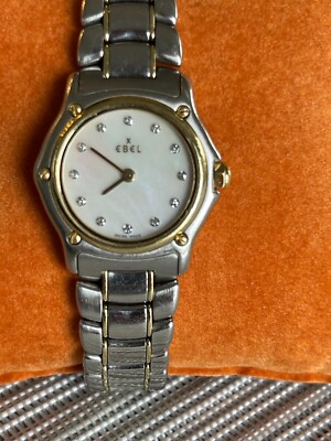 Ladies Ebel Sport Classique with Mother of Pearl / Diamond face and gold bezel. 
