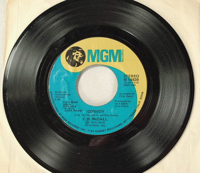 C.W. McCall: ''Convoy'' b/w ''Long Lonesome Road''; MGM 45 Catalog #M14839; EXC-