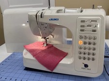 Máquina de coser para computadora Juki HZL-E61, funciona bien, incluye manual y cubierta