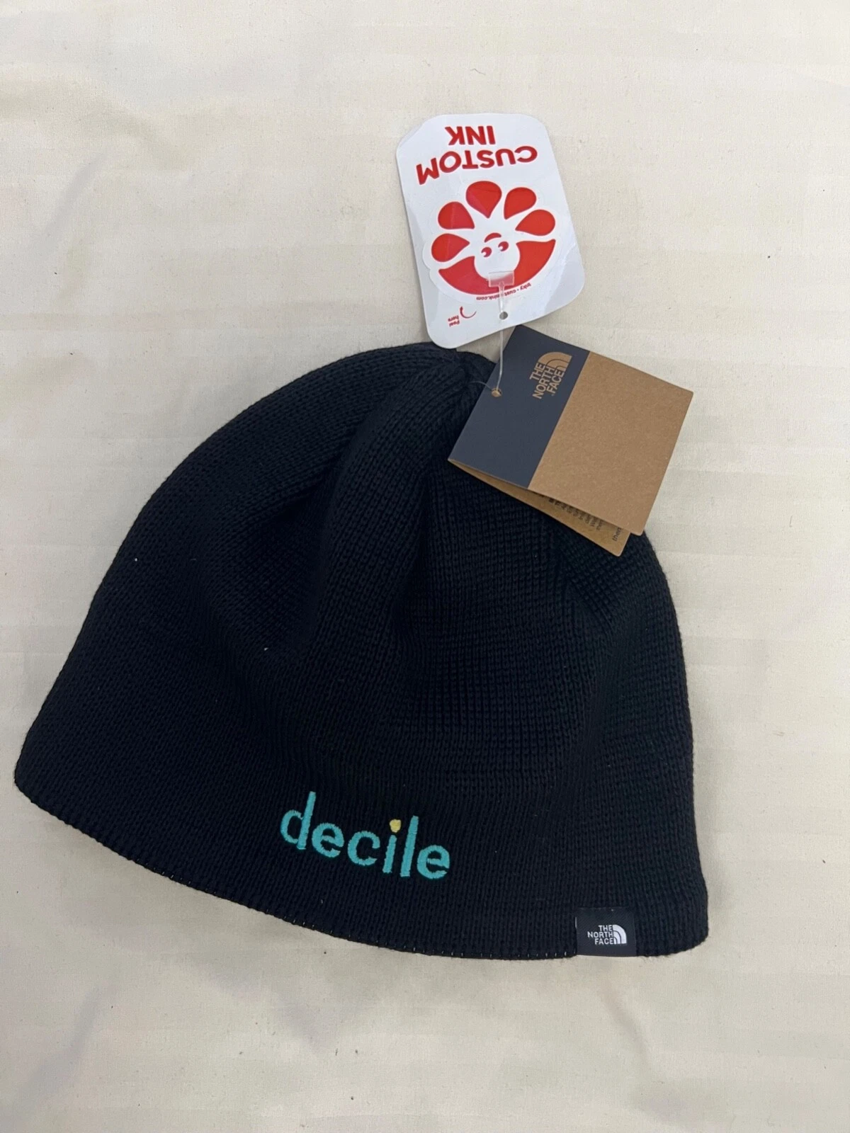 The North Face TNF Mountain Beenie in black with custom ink monogram