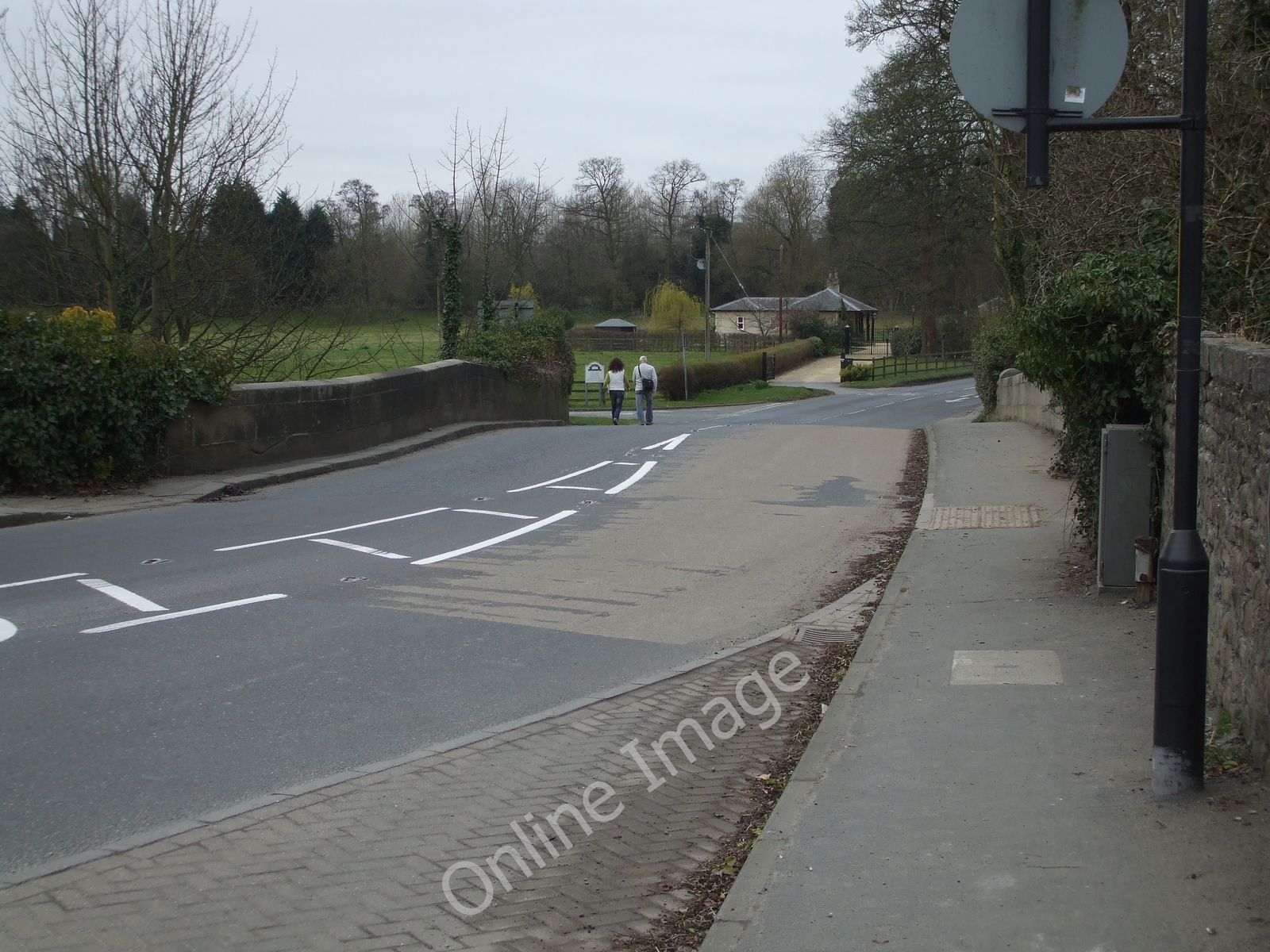 Photo 12x8 B6265 over Bridge Ripon The two folks walking are