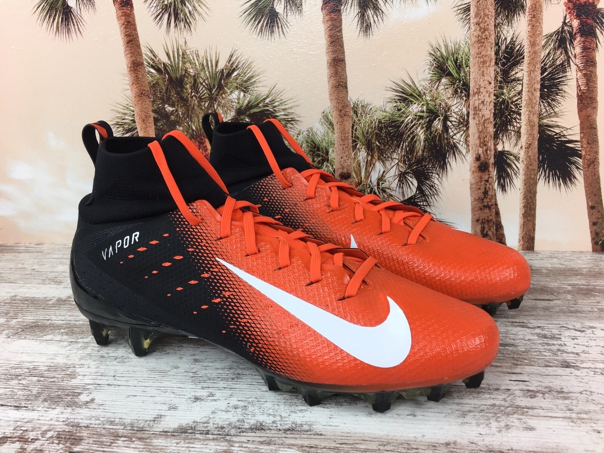 orange and black football cleats