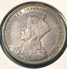 1935 Canadian Silver Dollar Impressive rainbow toning. Key date Mint