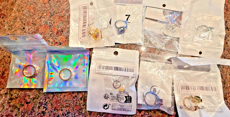 9 Rings; New in Pkgs; 2 Bands; 7 w Gems;  Diff Colors & Styles; Ages?