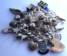 Vintage 101.6g solid silver charm bracelet,many curious silver charms inc moving