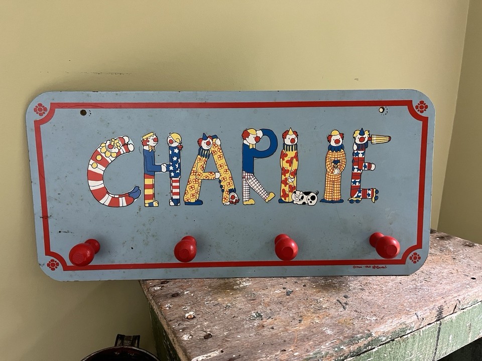 A genuine MCM clown-letter name plaque for 'CHARLIE' — the kind of wonderfully weird vintage kids' room artifact that stops people in their tracks.