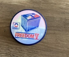 Delco Freedom V Battery Camel Vari-Vue Flicker Badge Never Needs A Drink