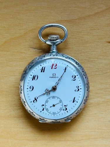 Antique Omega silver case pandent pocket watch,  silver chain