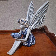 Blue White Seated Fairy Figurine W Large Wings Holding Flower Bowl Blue White Seated Fairy Figurine W Large Wings Holding Flower Bowl
