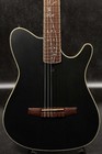 Black Ibanez TOD10N transparent flat guitar with gold hardware, five-pickup neck, and subtle floral leaf pattern on fretboard.