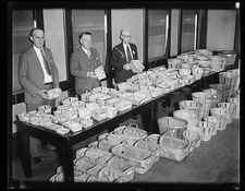 Photo:Men with display of baskets for food