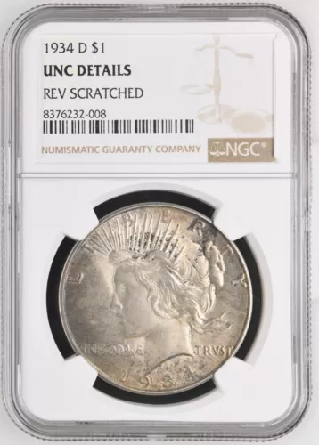 1934-D TONED  $1  PEACE SILVER DOLLAR  - NGC UNC DETAILS "REV SCRATCHED"