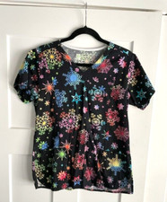 Women's Scrub Top - size small. Snow flakes on a black background.