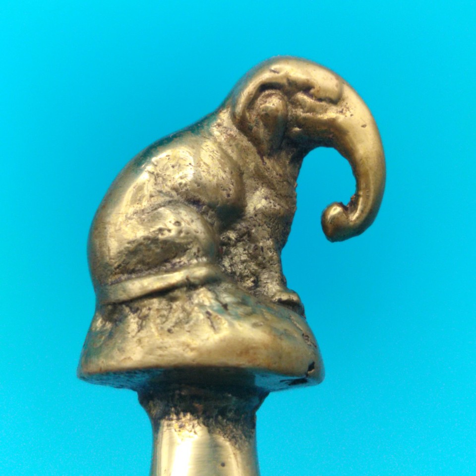 A solid brass elephant-handled letter opener — the kind of desk piece that makes every guest pick it up and ask where you got it.
