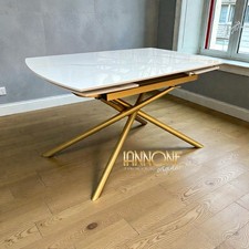 TAVOLO ROTANTE   MODERNO ALLUNGABILE IN CERAMICA GAMBE METALLO COLORE ORO.