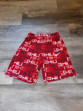 Red, Black, And White Nike Boys Shorts With Nike Pattern. Size M