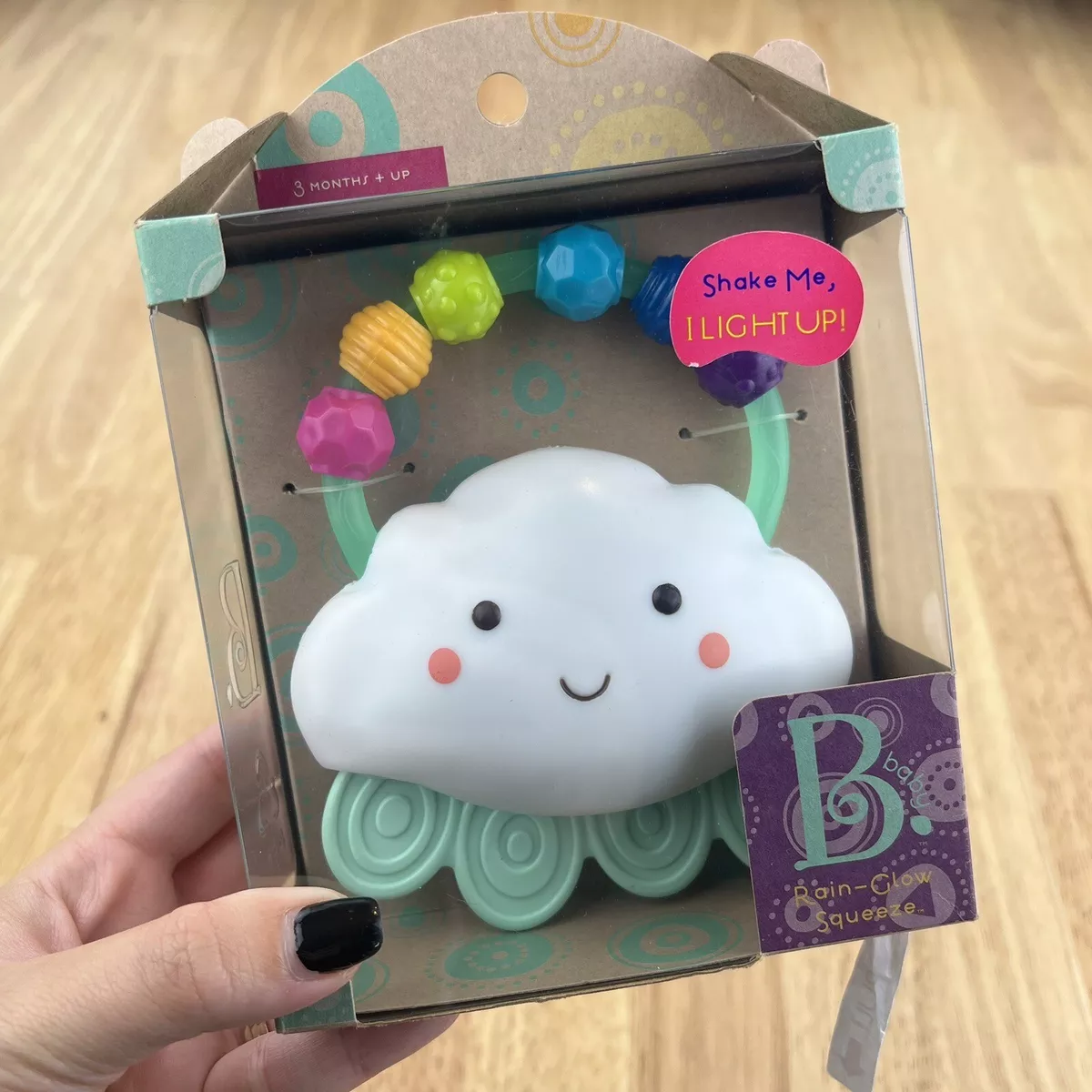 B. toys Rain Glow Squeeze Light Up Cloud Rattle Toy Baby Teether