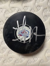 autographed Josh Manson avalanche team puck with proof photo 